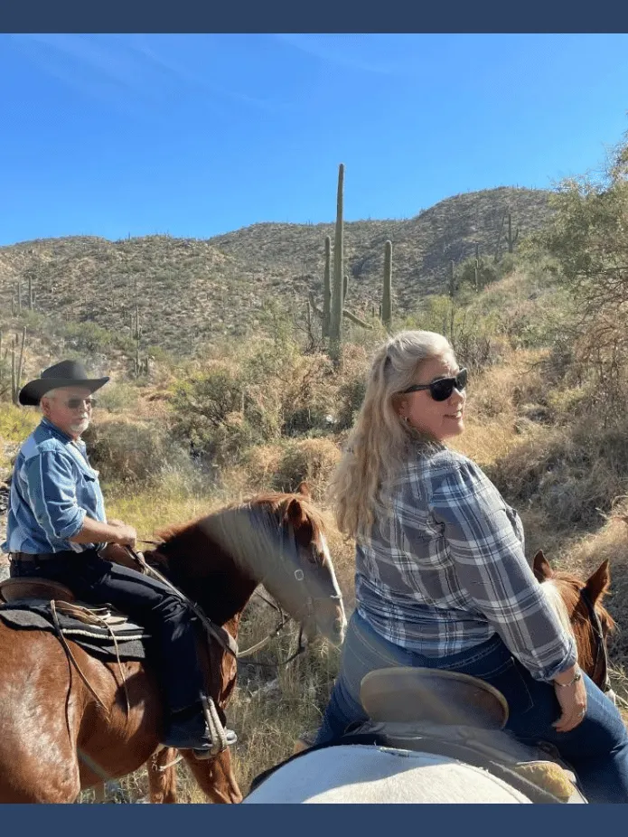 Sher on a horse in Tucson, looking over her shoulder